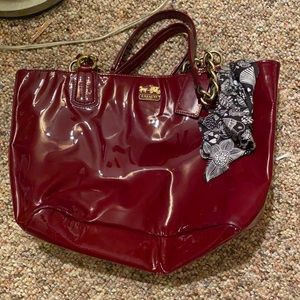 Shiny burgundy Coach bag